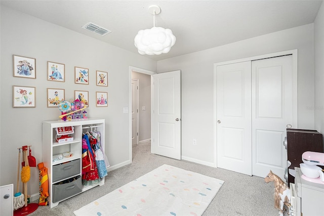 carpeted bedroom featuring a closet