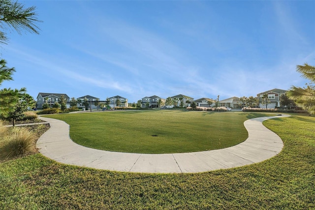 view of community featuring a lawn