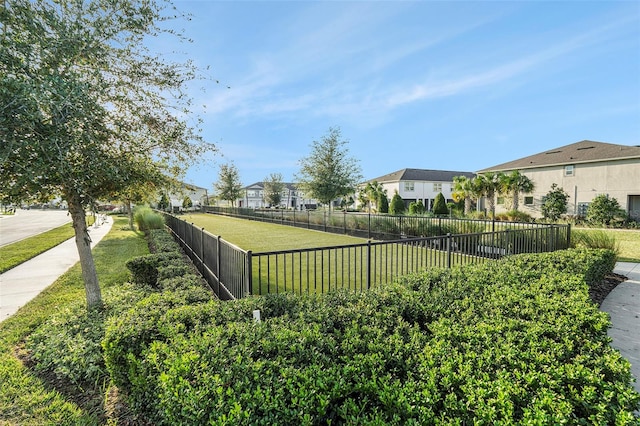 view of home's community with a lawn