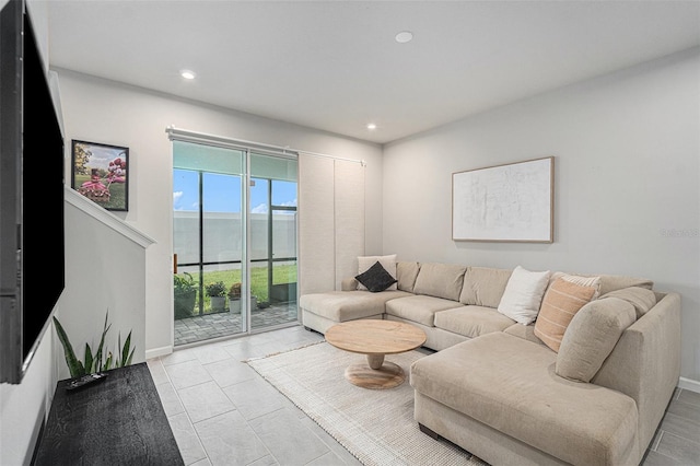 living room with light tile patterned flooring and a mountain view