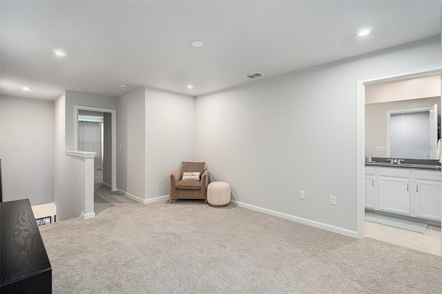 sitting room with light carpet