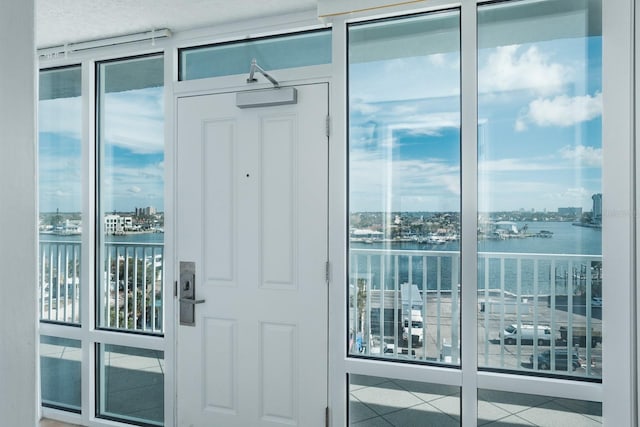 entrance to property with a water view