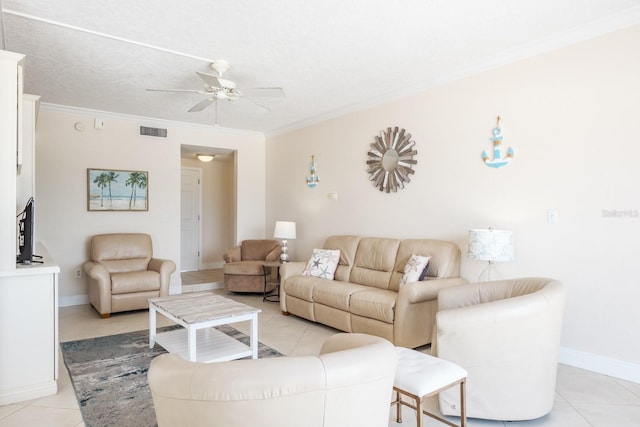 living room featuring ornamental molding, a textured ceiling, ceiling fan, and light tile patterned flooring