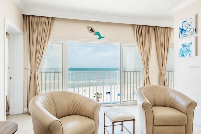 sitting room featuring ornamental molding, a water view, a healthy amount of sunlight, and light tile patterned floors