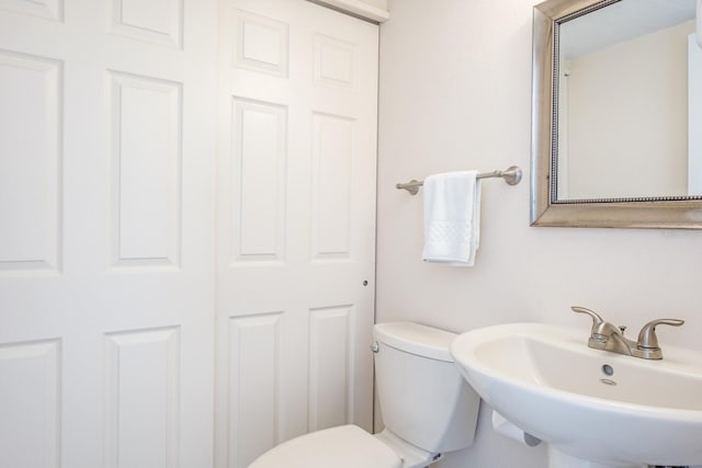 bathroom featuring sink and toilet