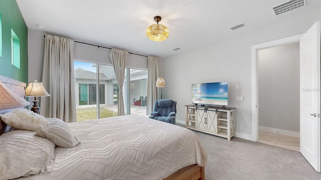 bedroom featuring carpet flooring and access to exterior