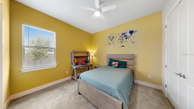 carpeted bedroom featuring ceiling fan