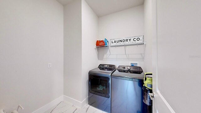 laundry area with separate washer and dryer