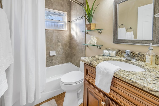 full bathroom with hardwood / wood-style floors, vanity, toilet, and shower / bath combo with shower curtain