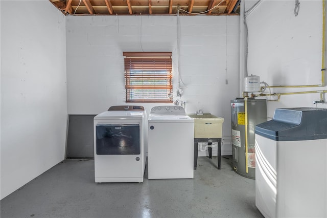 washroom featuring washer and clothes dryer and electric water heater