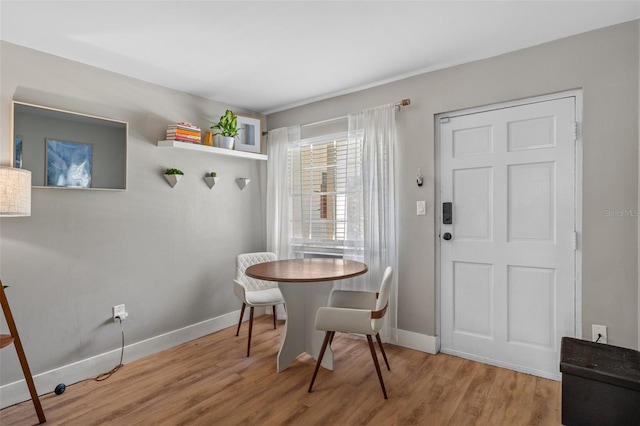 dining space featuring light hardwood / wood-style floors