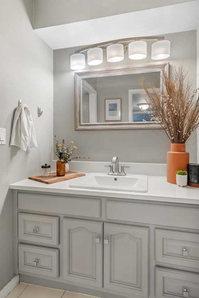 bathroom with tile patterned flooring and vanity