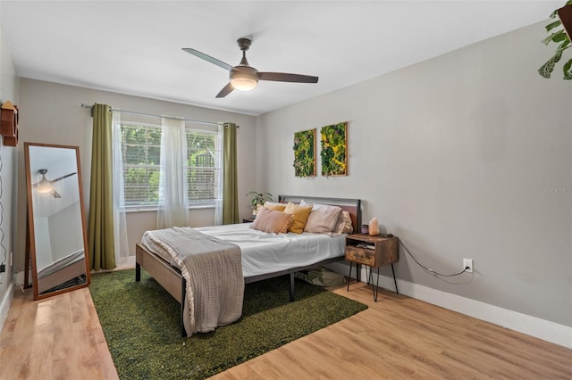 bedroom featuring wood-type flooring and ceiling fan