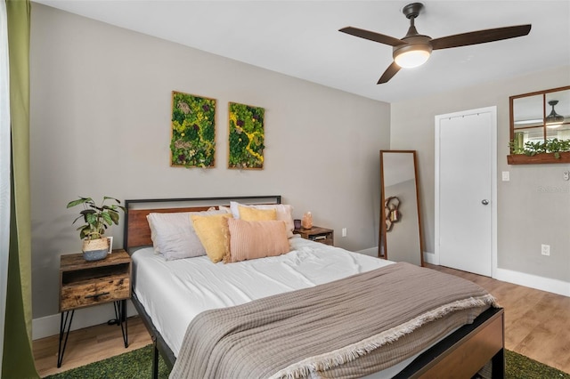 bedroom featuring ceiling fan and hardwood / wood-style flooring