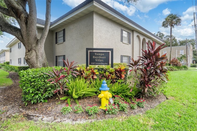 view of side of home featuring a lawn