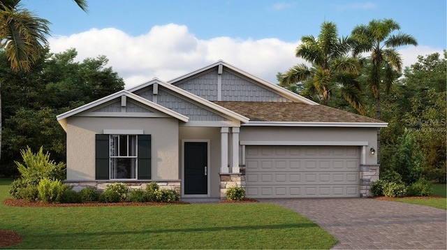 craftsman-style house featuring a garage and a front yard