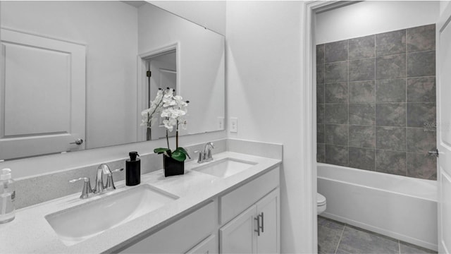 full bathroom featuring toilet, bathtub / shower combination, vanity, and tile patterned floors