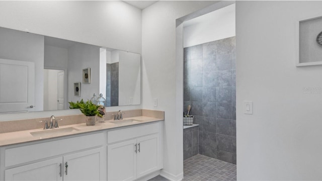 bathroom featuring vanity and a tile shower