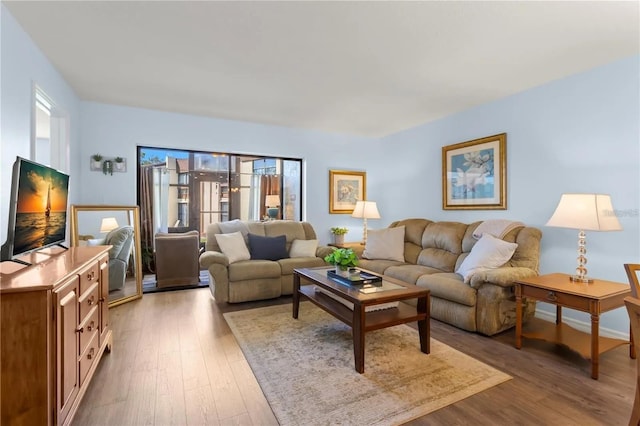 living room featuring plenty of natural light and hardwood / wood-style floors