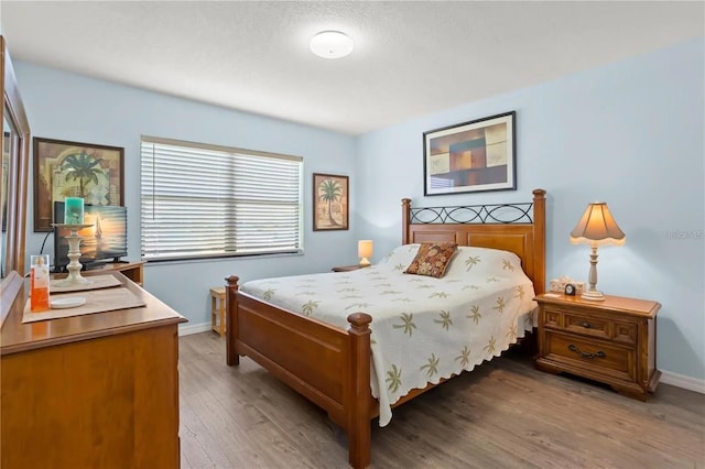 bedroom with wood-type flooring