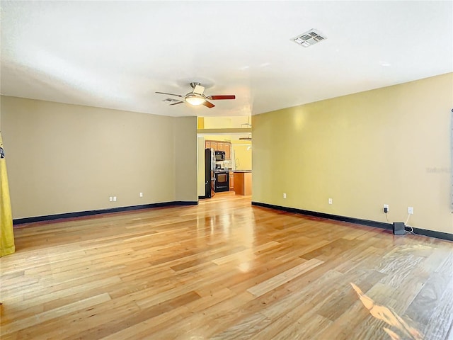 interior space featuring ceiling fan and light hardwood / wood-style floors