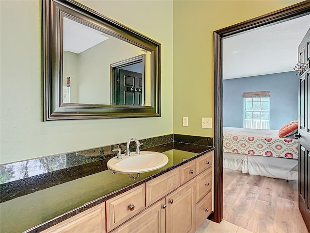 bathroom featuring hardwood / wood-style floors and vanity