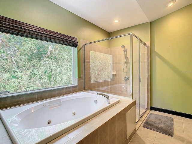 bathroom with tile patterned floors and plus walk in shower