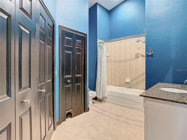 full bathroom with tile patterned flooring, shower / bath combination with curtain, toilet, and vanity