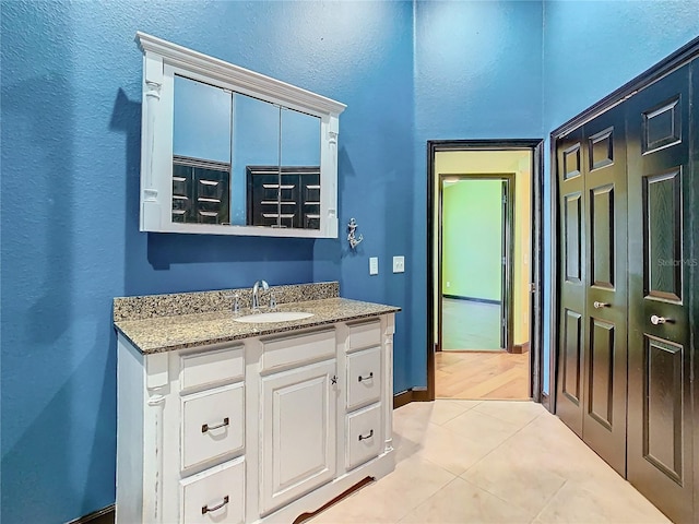 bathroom featuring tile patterned floors and vanity