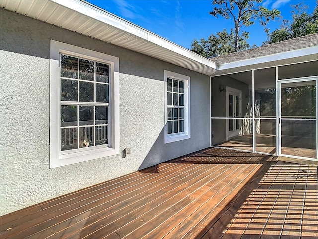 deck with a sunroom