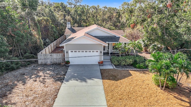 view of front of house with a porch and a garage