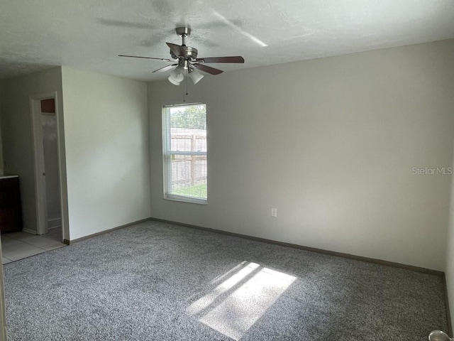 unfurnished room featuring carpet flooring and ceiling fan