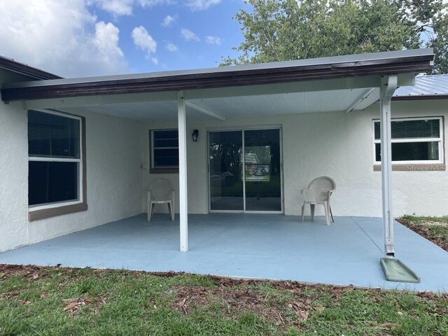 back of house with a patio area