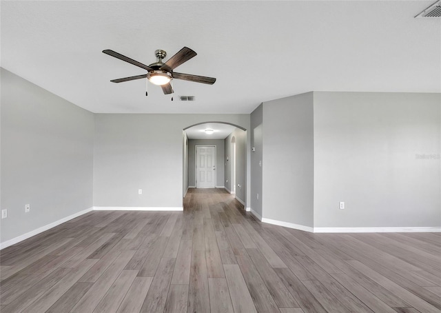 spare room featuring ceiling fan and light wood-type flooring