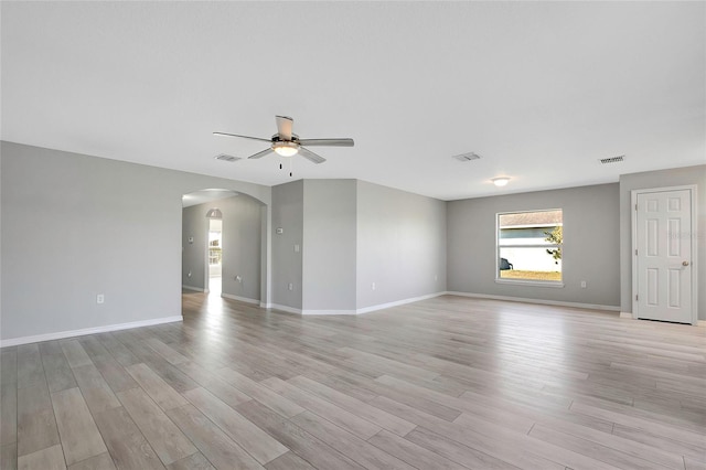 spare room featuring light hardwood / wood-style flooring and ceiling fan