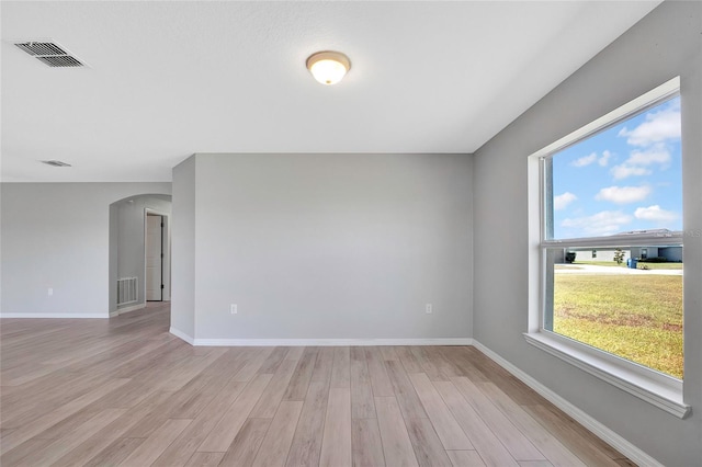 spare room featuring light hardwood / wood-style flooring