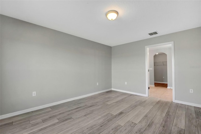 unfurnished room featuring light hardwood / wood-style floors