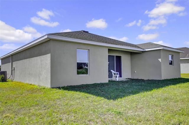 back of house with a yard