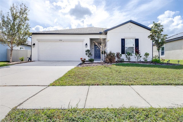 ranch-style house with a garage and a front yard