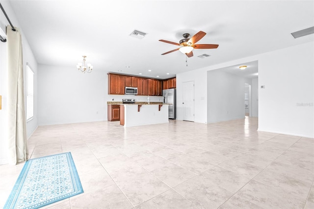 unfurnished living room with ceiling fan with notable chandelier