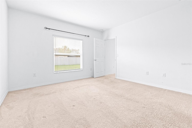 spare room with light colored carpet