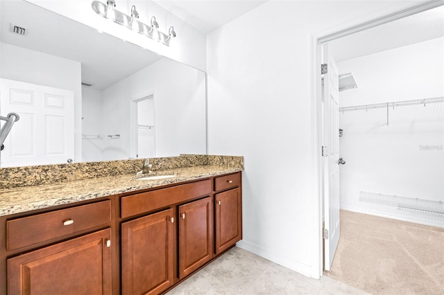 bathroom featuring vanity and tile patterned flooring