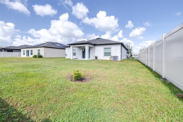 back of house with a yard