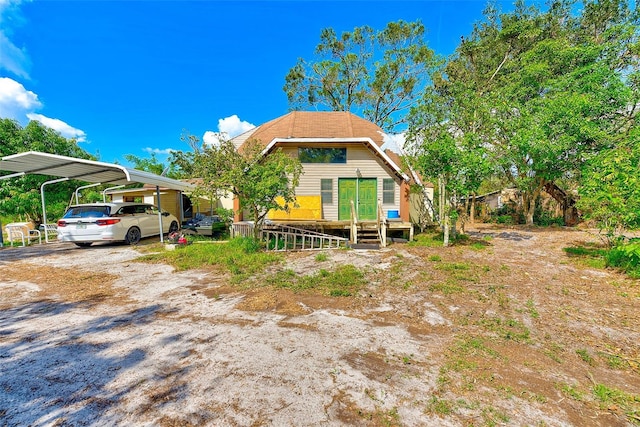 exterior space with a carport