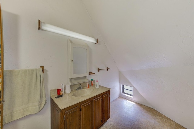 7923 18th Ave E, Palmetto, FL 34221 - bathroom featuring vaulted ceiling, vanity, and tile patterned floors