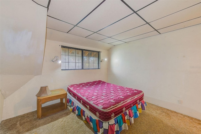 carpeted bedroom featuring a paneled ceiling