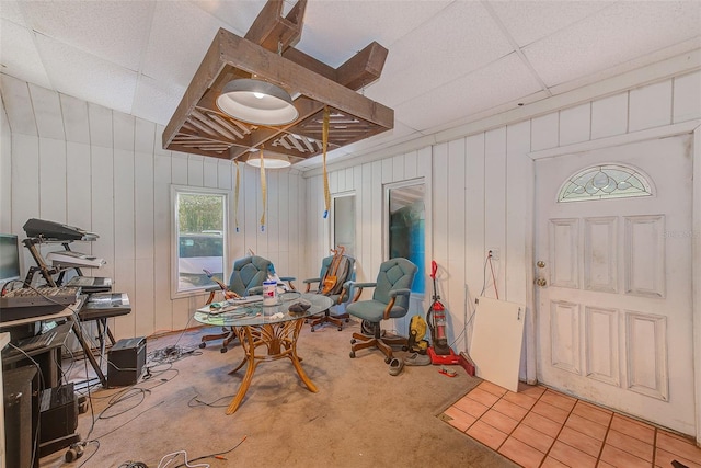 7923 18th Ave E, Palmetto, FL 34221 - interior space with light colored carpet, a drop ceiling, and wood walls