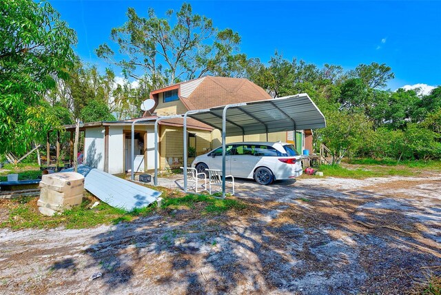 7923 18th Ave E, Palmetto, FL 34221 - view of front of property with a detached carport and driveway