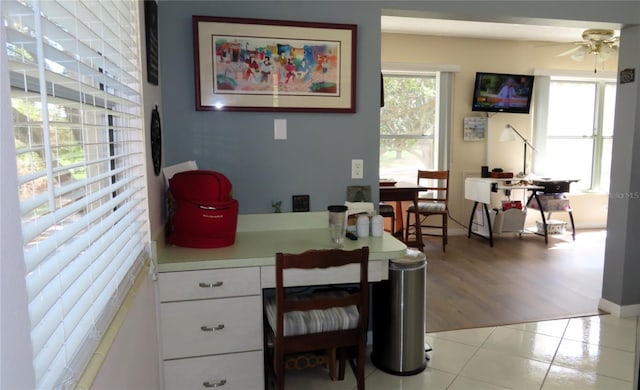 office area with light hardwood / wood-style floors and ceiling fan