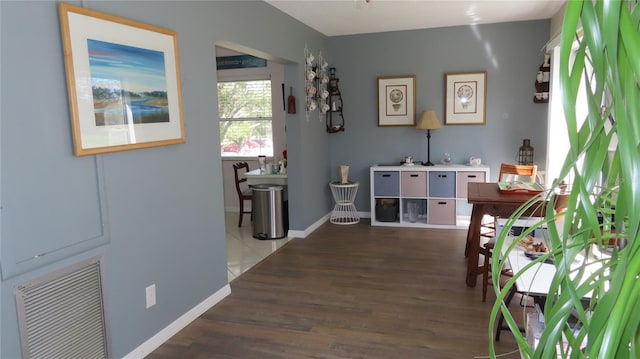 hallway featuring dark hardwood / wood-style flooring